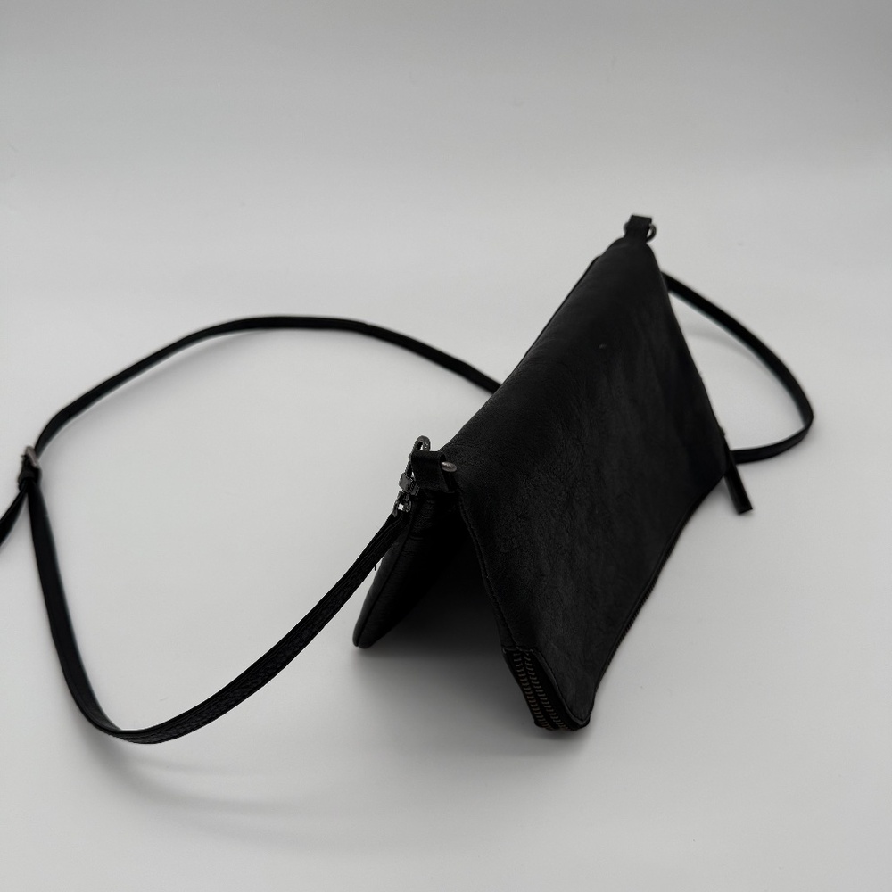 Black leather foldover clutch/crossbody bag by Swedish label, Hope